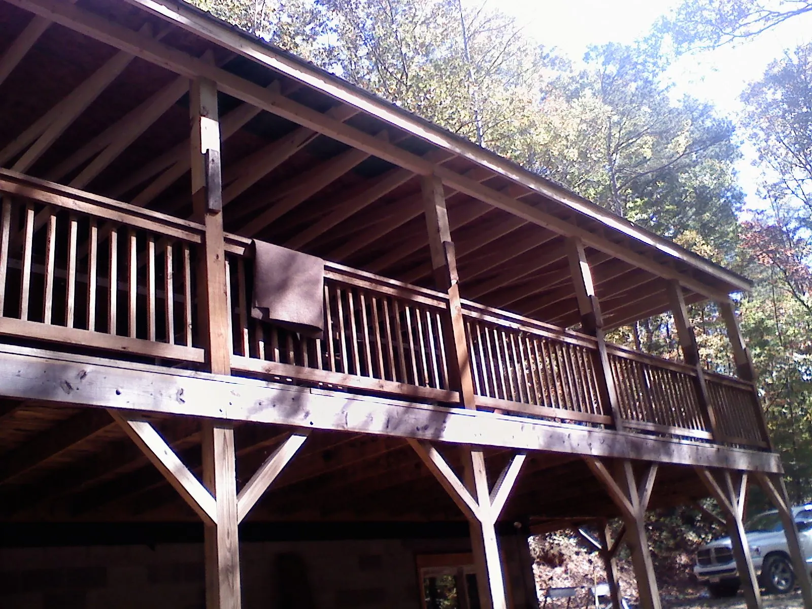 Timber framing under a new elevated porch and deck — Roof Leak Repair in Blountsville by Roofing Brothers